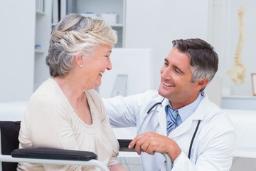 Male doctor looking at female patient
