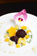 Thai dessert of black sticky rice and mango with coconut cream