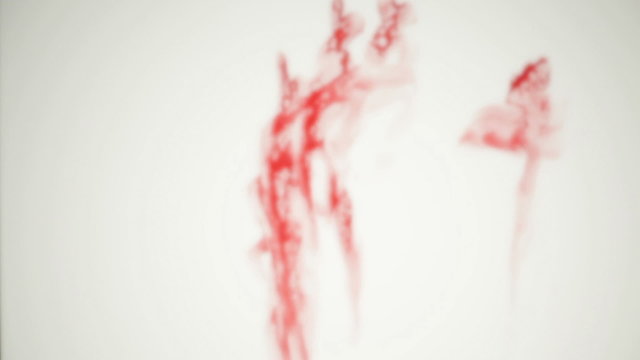 Blood-smeared defocused hand - probably of a crime victim 