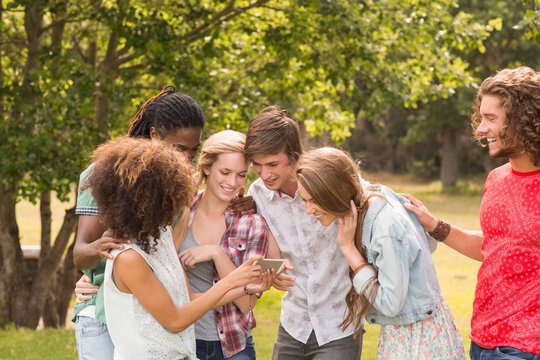 Happy friends in the park taking selfie