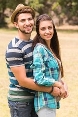 Fototapeta premium Young couple hugging in the park