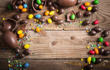 Chocolate Easter Eggs Over Wooden Background