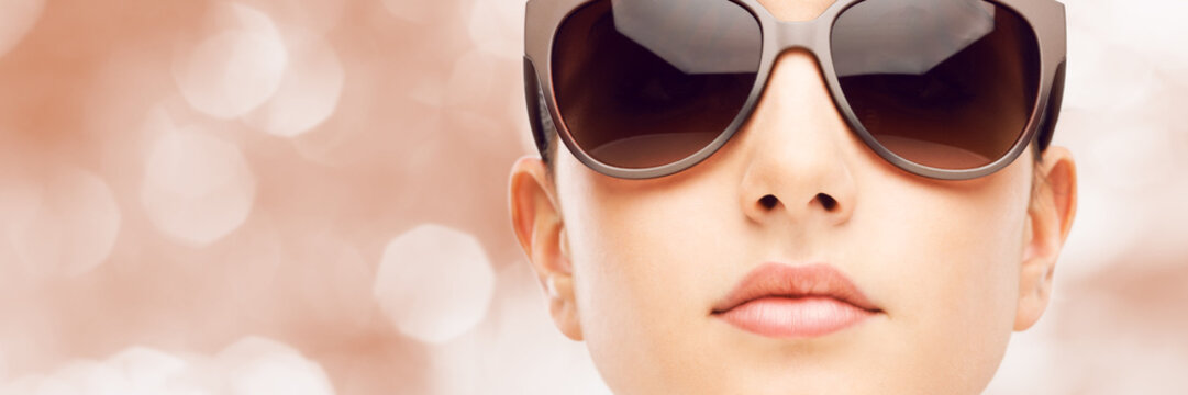Young fashion model with sunglasses