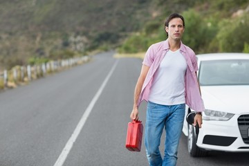 Man walking and holding petrolcan