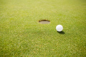 Golf ball near the hole