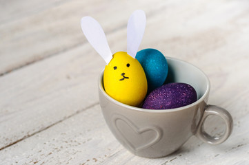Colored easter eggs with egg-shaped bunny