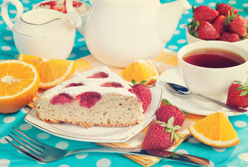 Cake with strawberries and breakfast on the table. Vintage retro