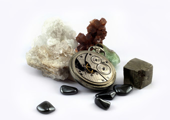 Old pocket watch and gemstones