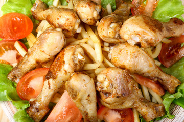 fried chicken legs, potato and vegetables