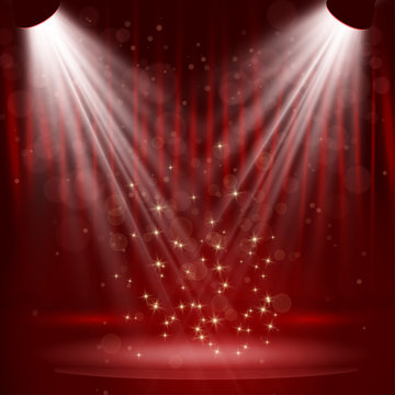 Spotlight on stage curtain with stars.