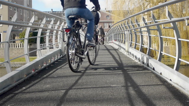Anonymous people on a bridge. A cityscape