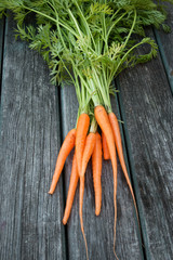 baby carrot on wooden background