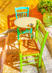 two chairs and a coffee table in Plaka, Athens Greece. HDR