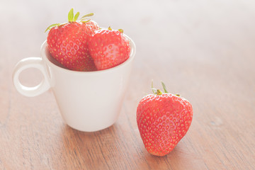 Fresh strawberries on wooden table