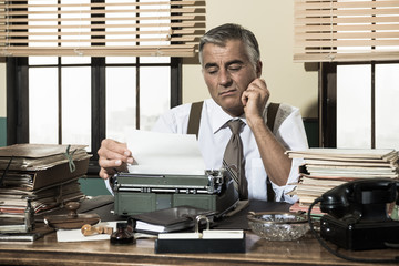 Disappointed office worker working at desk