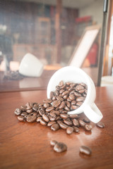 Roast coffee bean in white mug