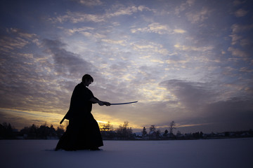 Black oriental martial arts warrior winter training