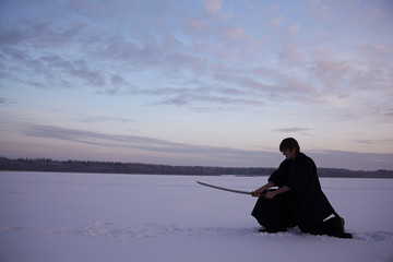 Black oriental martial arts warrior winter training