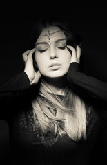 Portrait of a beautiful girl on a black background.