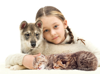 child and a puppy and kittens