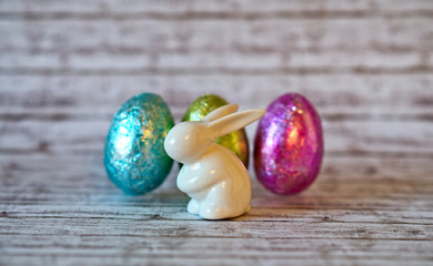 Easter Bunny Figurine with Colored Chocolate Eggs