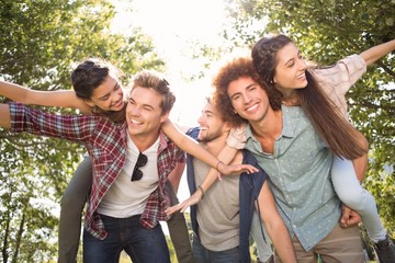 Happy friends in the park taking selfie