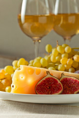 cheese with fruits and sweet wine