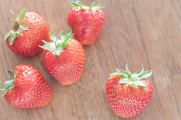 Fresh strawberries on wooden table