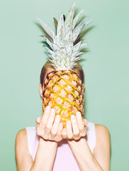 girl holding pineapple. Fashionable stylish summer