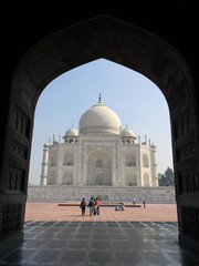 Naklejka premium Taj Mahal from an arched portal of adjacent mosque