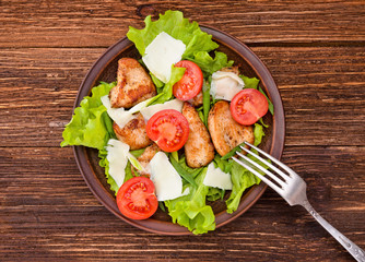 Salad with meat and tomatoes.