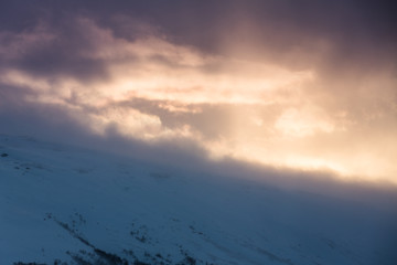 Dramatic clouds rolling over mountains