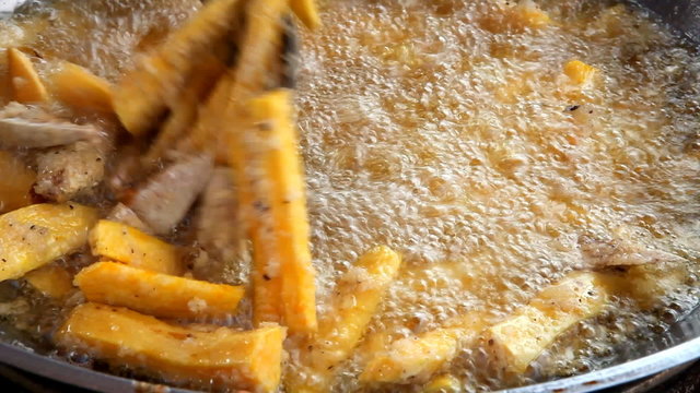 fried taro and sweet potato in boiling oil