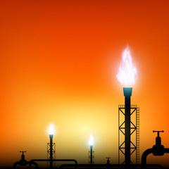 tube with a blue flame of gas on a sunset background