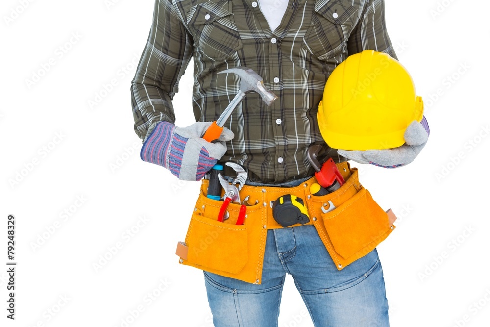 Poster manual worker wearing tool belt while holding hammer and helmet