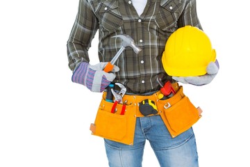Obraz na płótnie Canvas Manual worker wearing tool belt while holding hammer and helmet