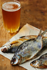 Dried salted fish and a glass of beer