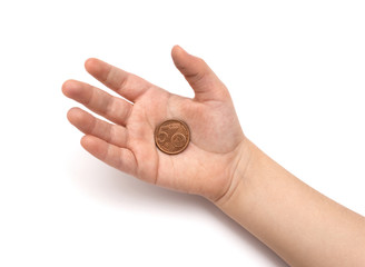 Coins in child's hand on white background