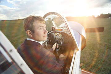 Male pilot a small plane