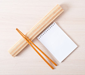 Sushi menu chopsticks for sushi on bamboo napkin