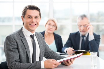 Smiling man having an interview with employers