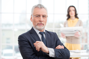 Businessman and assistant with papers
