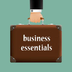 man in a suit holding a brown briefcase with the words the essen