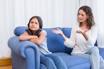 Upset mother looking at her daughter