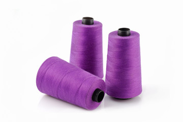 Three Large Spools of Purple Thread.