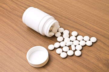 Dropped container with tablets