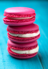 Colorful and tasty cookies makaroons on a wooden