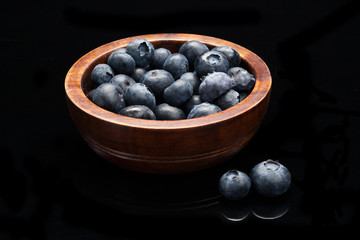 Blueberries in a wooden bowl.