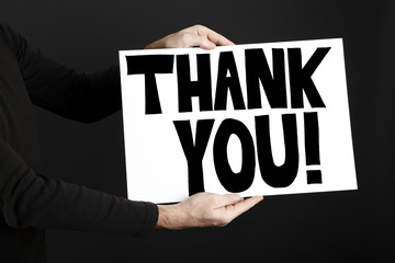 Man holding poster with thank you