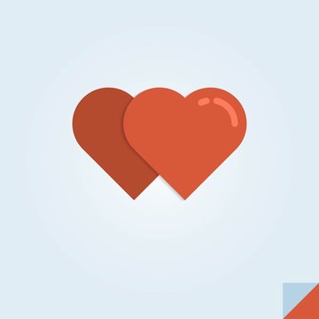 vector illustration of two red hearts on a folded paper